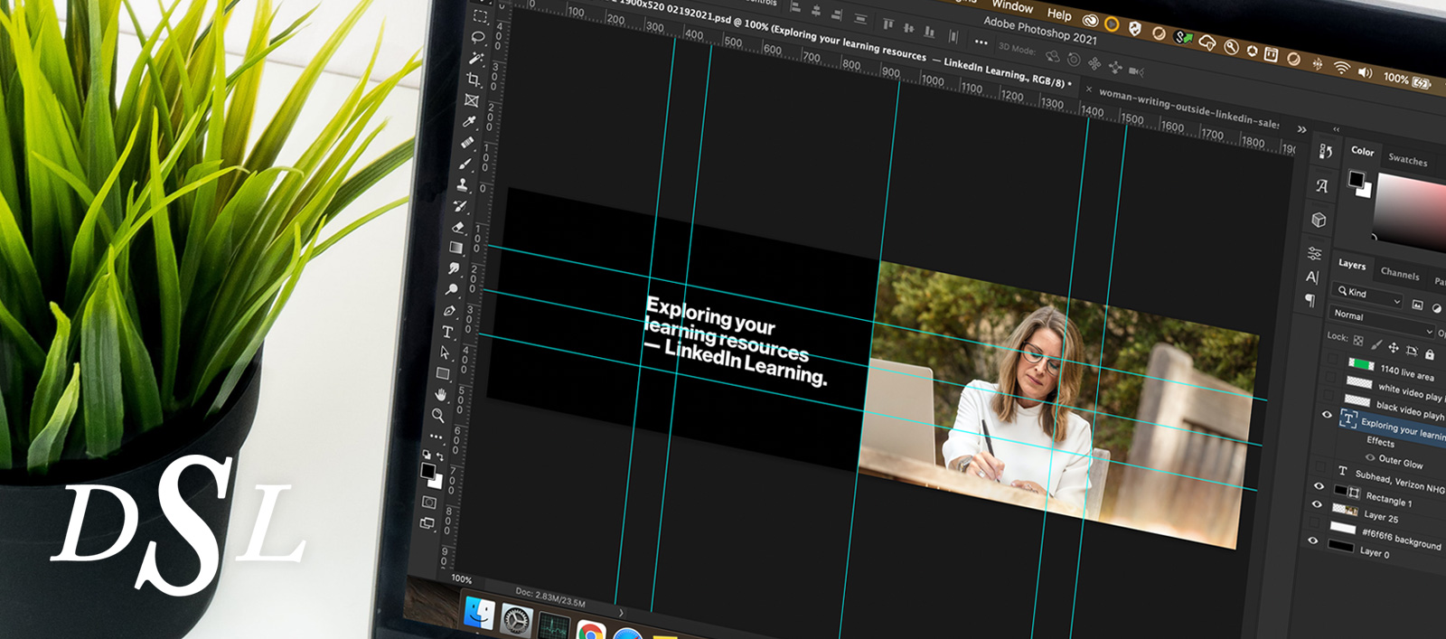 A laptop with an Adobe Photoshop document on the screen.